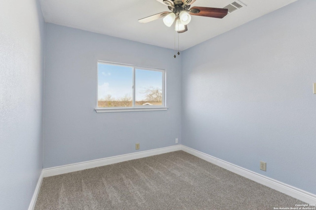 empty room with carpet and ceiling fan