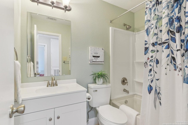 full bathroom with vanity, shower / bath combo, and toilet