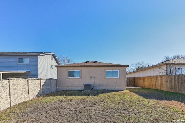 rear view of house with a yard