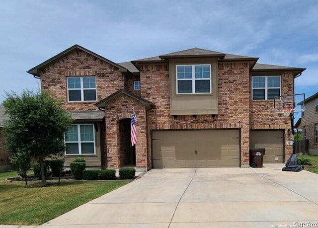 view of front of property with a garage and a front yard