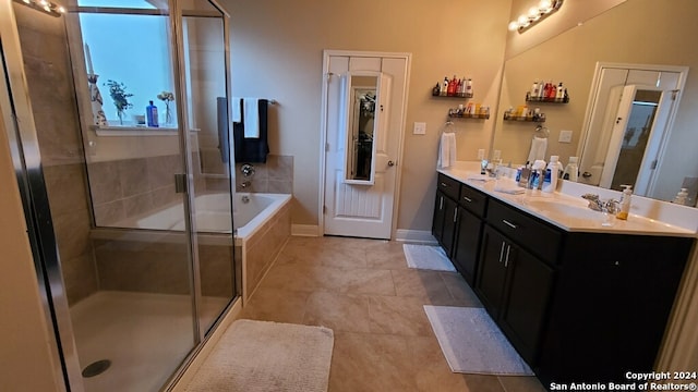 bathroom with vanity, tile patterned floors, and separate shower and tub