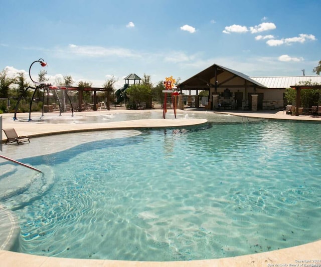 view of pool featuring a patio