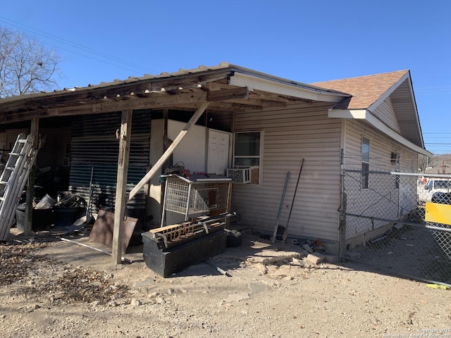 rear view of house with cooling unit