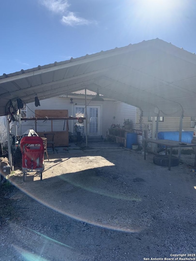 view of vehicle parking with a carport