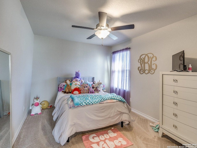 bedroom featuring ceiling fan and light carpet