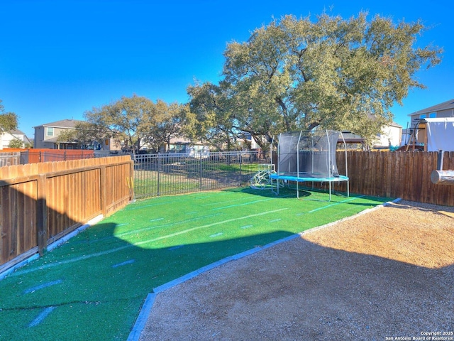 view of yard featuring a trampoline