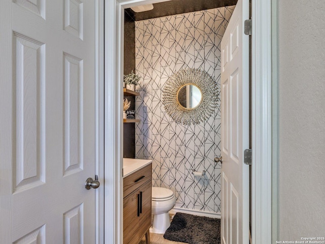 bathroom with vanity and toilet