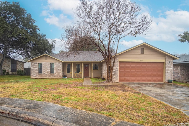 ranch-style house with a garage and a front yard