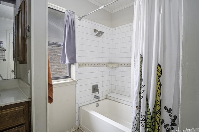 bathroom featuring crown molding, shower / bath combo, vanity, and a textured ceiling