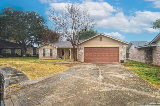 ranch-style home with a garage and a front lawn