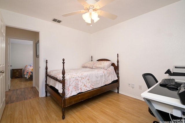 bedroom featuring ceiling fan and hardwood / wood-style floors