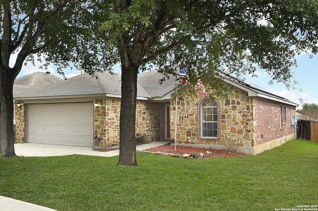 single story home featuring a garage and a front yard