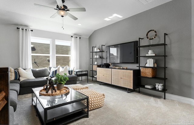 carpeted living room featuring lofted ceiling and ceiling fan