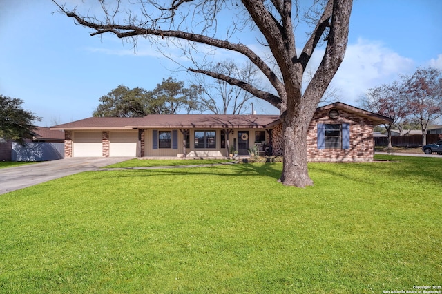 ranch-style house featuring a garage and a front yard