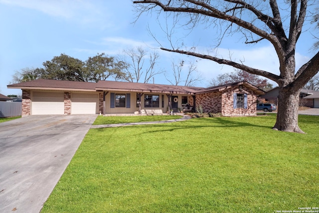 single story home featuring a garage and a front yard