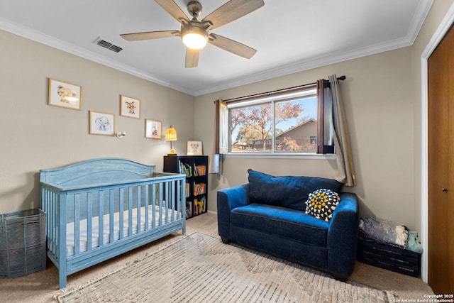 bedroom featuring crown molding, light colored carpet, and ceiling fan