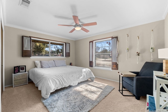 carpeted bedroom with crown molding and ceiling fan