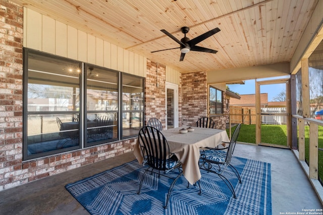 sunroom / solarium featuring wooden ceiling and ceiling fan