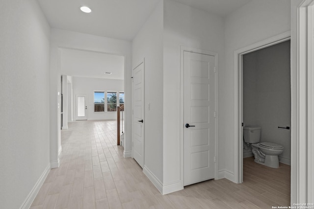 hallway featuring light hardwood / wood-style flooring