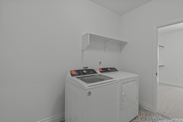 washroom with light carpet and washer and clothes dryer