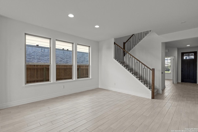 unfurnished living room with light hardwood / wood-style floors