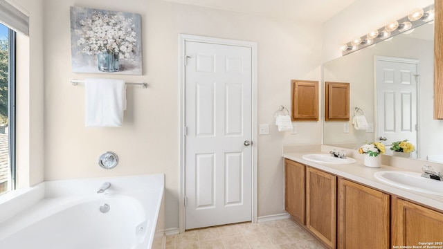 bathroom with vanity and a bathtub