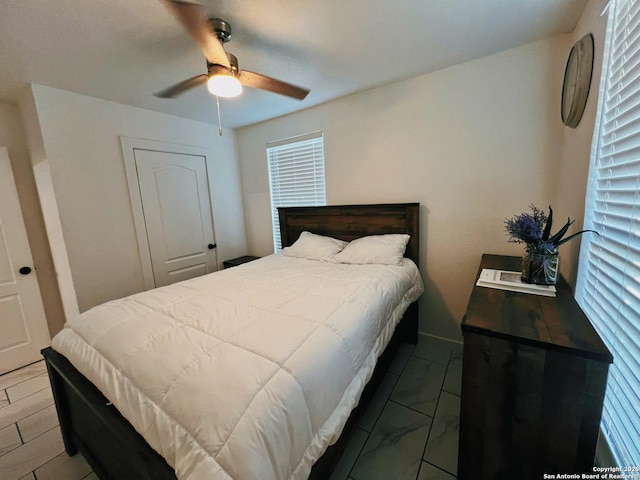 bedroom featuring ceiling fan