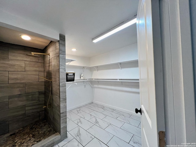 bathroom featuring a tile shower