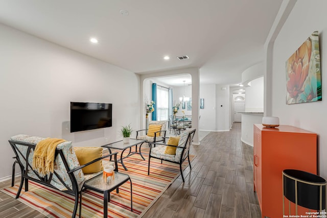 living room featuring a notable chandelier