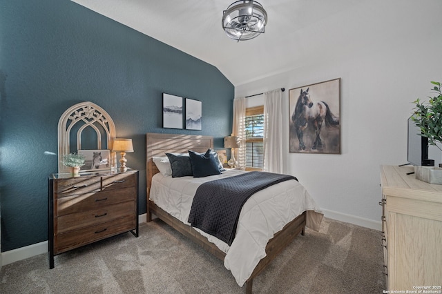 bedroom with lofted ceiling and light carpet