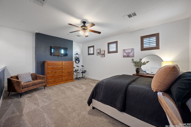 bedroom featuring light carpet and ceiling fan