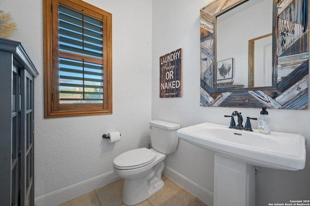 bathroom with tile patterned floors and toilet