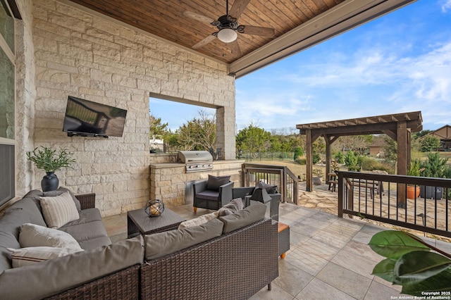 view of patio / terrace featuring an outdoor living space, grilling area, ceiling fan, and exterior kitchen