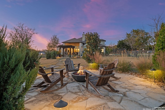 patio terrace at dusk with a fire pit