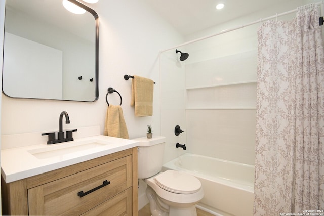 full bathroom with vanity, shower / tub combo with curtain, and toilet