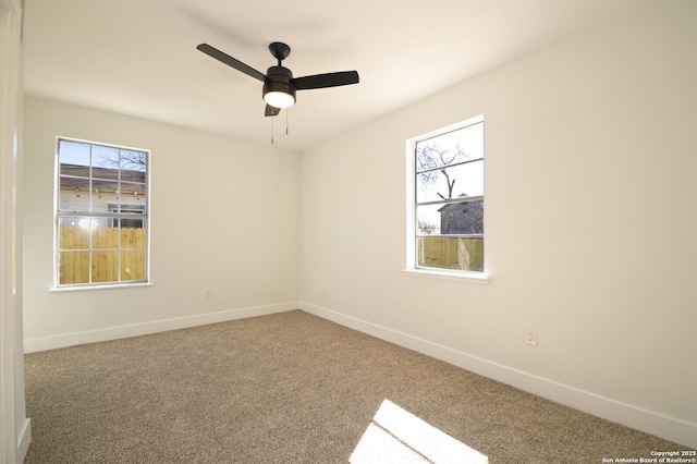 carpeted empty room with ceiling fan