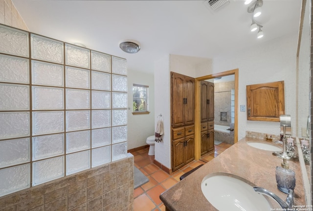 bathroom featuring tile patterned floors, toilet, and vanity