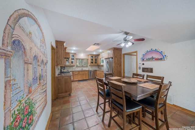 dining area with ceiling fan