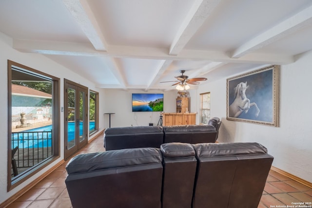 living room featuring light tile patterned floors, beam ceiling, french doors, and ceiling fan