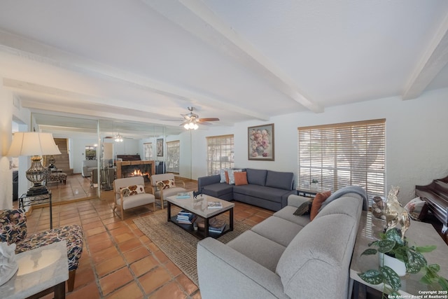 tiled living room with ceiling fan and beamed ceiling