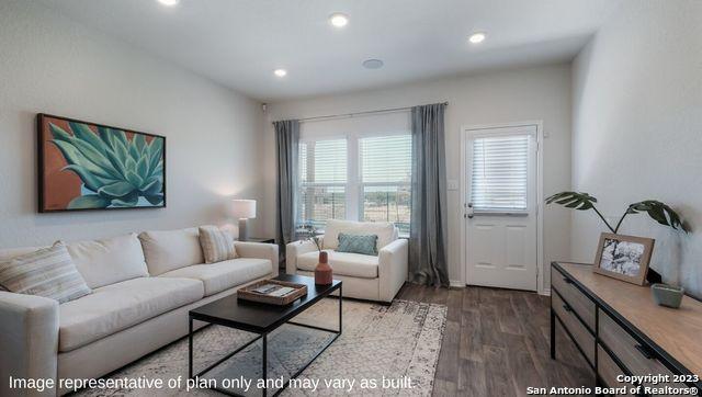 living room featuring recessed lighting and wood finished floors