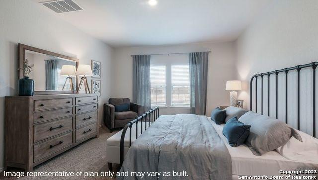 bedroom featuring visible vents and carpet floors
