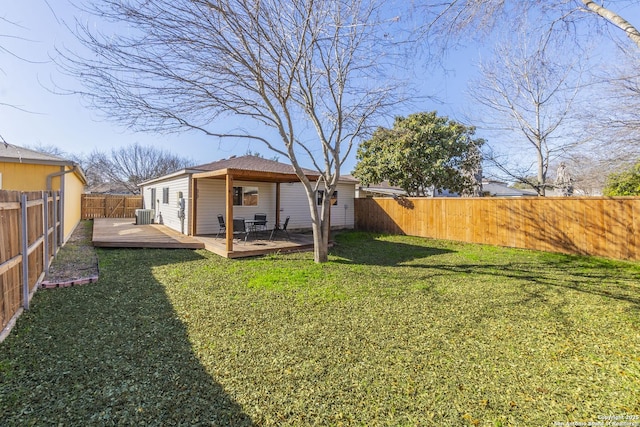 view of yard featuring a wooden deck and central AC