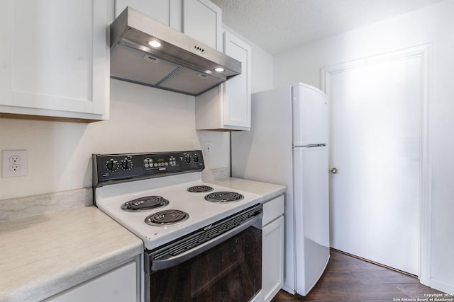 kitchen featuring white cabinetry, dark hardwood / wood-style flooring, electric range oven, and a textured ceiling