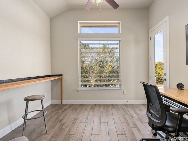 office with lofted ceiling, ceiling fan, and light wood-type flooring