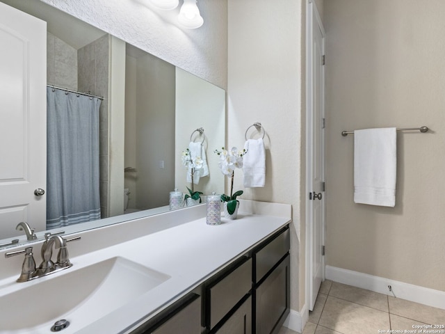 bathroom featuring vanity, tile patterned floors, and a shower with shower curtain