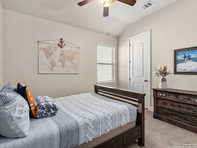 carpeted bedroom with lofted ceiling and ceiling fan