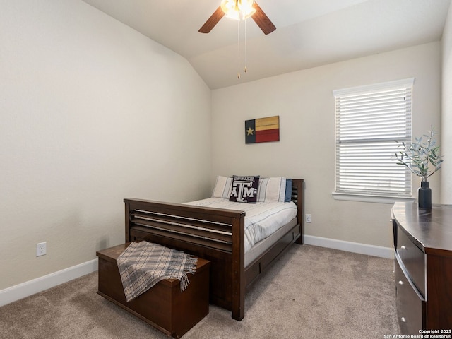 bedroom with vaulted ceiling, light carpet, and ceiling fan