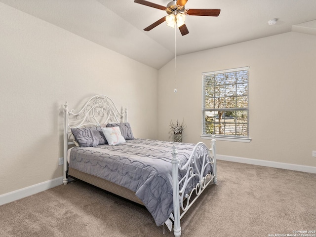 carpeted bedroom featuring lofted ceiling and ceiling fan