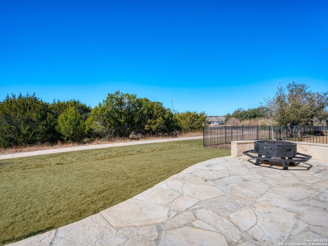 view of patio / terrace featuring a fire pit